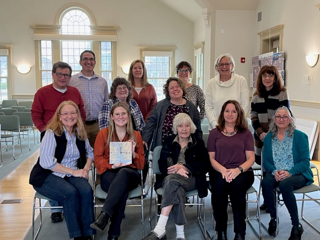 Town Hall Staff and Former Tax Collector Judith Tooker gather to wish Olivia Rugg well