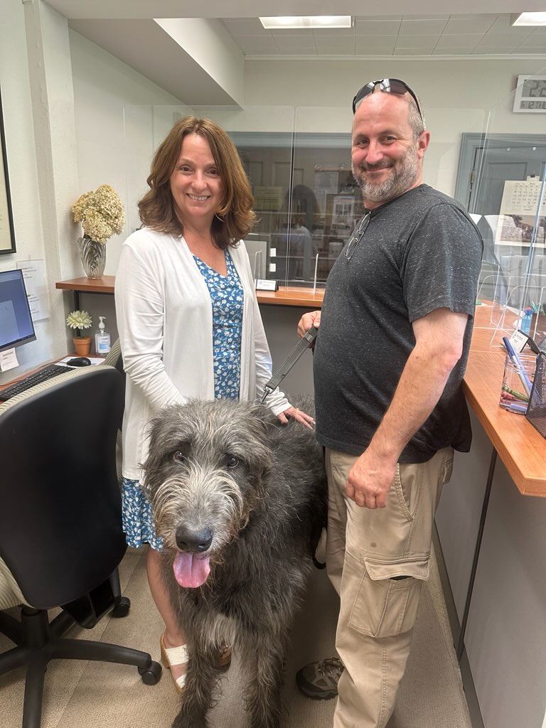 Four legged visitor to the Town Clerk's office for their Dog License, pictured with Vicki Urbowic
